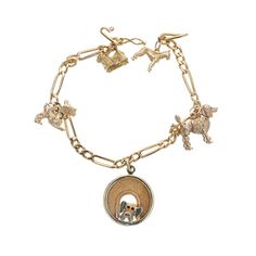 Link charm bracelet with five dog charms. The center charm is 2D, the others are 3D. The poodle and scottie have movable heads. 7.25 inches in length. 14k yellow gold Stamped: 14k 21.0 grams Chain: 7.25 Inches Antique Wedding Bands, Flexible Bracelet, Diamond Sapphire Engagement Ring, Antique Engagement Rings Vintage, Vintage Charm Bracelet, Gold Link Bracelet, Art Deco Bracelet, Antique Bracelets, Vintage Sapphire