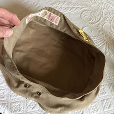 "Vintage Marine Corps Dress Uniform Kakey Tan Wool or Gaberdine Slip On Hat Cover. Berkshire Lee Uniform Cap Mfg. Co. This gaberdine hat cover is in great shape for its age. It has a Cleaners Tag on it. The Wool one has about 11 little holes around the top from a moth that got to it over it's storage time. Size: 6 7/8, 10 1/2\" From Side to Side, 4 1/2\" Tall Crown in Front, 21 3/4\" Around Crown, For other hats, jewelry and vintage items see: www.VeryVictorianStudio.etsy.com For sewing related Vintage Beige Visor Hat, Vintage Khaki Hat With Short Brim, Vintage Khaki Brimmed Hat, Vintage Brimmed Khaki Hat, Vintage Khaki Cap, Vintage Marine Corps, Tall Crown, Marine Corps, Moth