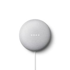 the google home speaker is on top of a white stick and plugged into an ipod charger