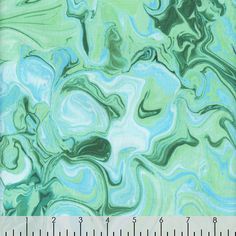 green and blue marble paper with ruler on it