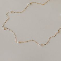 "This pearl choker is handcrafted with freshwater pearls and 14k gold-filled chain which is hypoallergenic and tarnish resistant.Perfect for your everyday look! ------------------------------------------------- >>Length: 38cm,40cm,42cm >>Material: 14k gold filled chain with 7 Small  Freshwater Pearls >>Pearl Diameter: 3-3.5mm >>Sensitive skin friendly & tarnish resistant ------------------What is gold filled ------------------ Most of our findings and wires are made with 14k gold filled.\"Gold-filled\" is a USA industry standard that legally requires 5% pure gold by weight. It is a solid layer of gold bonded to another metal through heat and pressure. It does not wear off or turn colours over time, and if taken care of properly it can last a lifetime.Gold-filled jewellery is a cheaper, yet 14k Gold-filled Necklace With Pearl Charm For Wedding, 14k Gold Filled Necklace With Pearl Charm For Wedding, 14k Gold Filled Pearl Chain Necklace For Wedding, Wedding 14k Gold Filled Necklaces With Pearl Chain, Wedding Necklace With Pearl Chain In 14k Gold, Dainty Gold Pearl Bridal Necklace, Wedding Pearl Chain Necklace In 14k Gold, Pearl Bridal Necklace With Delicate Chain For Anniversary, Wedding 14k Gold Filled Pearl Chain Necklace