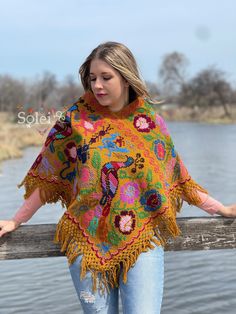 This beautiful Traditional Poncho is completely unique in both design and embroidery. It has a beautiful embroidered Peacock Design. It is Hand embroidered by Cross Stitch with details in cotton made on a loom. It comes in one size which fits sizes Small, Medium, Large and Extra Large. Bohemian Embroidered Festival Poncho, Traditional Embroidered One Size Shawl, Bohemian Multicolor Shawl With Embroidered Border, Traditional Embroidered One-size Shawl, Bohemian Shawl With Embroidered Border For Festival, Bohemian Shawl With Floral Embroidery For Festival, Bohemian Floral Embroidered Shawl For Festival, Traditional Poncho With Floral Embroidery, Traditional Embroidered Floral Poncho