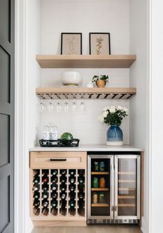 a wine cooler and some bottles in a room