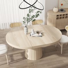 a dining room table with chairs and a vase on it