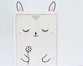 a cross stitch bunny rabbit with eyes closed