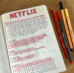 a notebook with the words netflix written on it and two pencils next to it