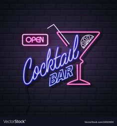 neon cocktail bar sign on brick wall