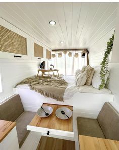 a bed sitting inside of a bedroom on top of a wooden floor