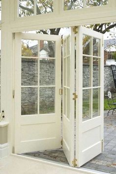 an open white door leading to a patio