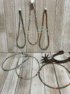 Made from sea beads **brown/turquoise - 17 inches **grey/red/orange - 17 inches **tan serape - 17 inches **earthtone - 16 inches **silver/brown/turquoise - 17 inches **pear/turquoise/rust - 16 inches Southwestern Style Large Beads For Beach, Southwestern Style Large Beads, Southwestern Style Large Beach Beads, Southwestern Choker With Colorful Round Beads, Adjustable Bohemian Choker With Polished Beads, Adjustable Beaded Necklaces With Polished Beads For Beach, Adjustable Polished Beaded Necklaces For Beach, Adjustable Polished Beads Choker, Festival Adjustable Choker With Polished Beads