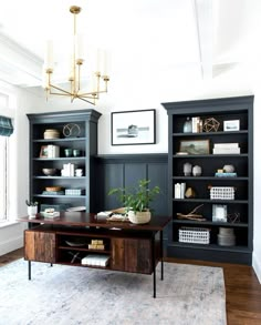 a living room filled with lots of furniture and bookshelves on top of each other