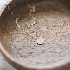 This 14k gold filled disc necklace has a beautiful hammered and polished finish. A lovely minimal piece which is perfect for layering with other necklaces as well as wearing on its own. 14k gold filled chain and spring clasp 14k gold filled hammered and polished disc - 9mm diameter Beautifully packaged in a gift box ready for gift giving Chain length available in 16/18/20 inches, perfect for layering.  Please message me for custom length. Additional discs can be added at a cost of £3.00 per disc Minimalist 14k Gold Round Disc Necklace, Minimalist Gold Plated Round Disc Necklaces, Minimalist 14k Gold Filled Round Disc Necklaces, Dainty Gold Round Disc Necklace, Minimalist Gold Plated Round Disc Necklace, Simple Hammered Rose Gold Jewelry, Dainty Gold-plated Round Disc Necklace, Simple Jewelry With Delicate Chain And Round Disc, Minimalist Hammered 14k Gold Filled Necklaces