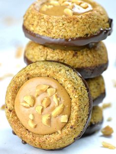 three cookies with peanut butter on top