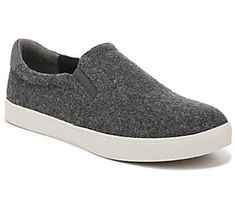 A perfect blend of skate park cool and city chic, the Madison slip-on sneaker offers a sleek profile, classic white rubber sidewalls, and an insole that keeps feet happy all day. From Dr. Scholl's. Slip-on Sneakers For Skateboarding With Rubber Sole, Gray Slip-on Sneakers With Ortholite Insole, Skateboarding Slip-on Sneakers With Rubber Sole, Low-top Slip-on Sneakers For Skateboarding, Sporty Slip-on Sneakers For Skateboarding, Textured Sole Synthetic Slip-ons For Streetwear, Streetwear Slip-on Sneakers With Removable Insole, Urban Slip-on Sneakers With Speckled Midsole, Comfortable Slip-ons With Textured Sole For Streetwear