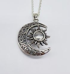 "This celestial moon and sun cremation pendant is a unique way to hold a loved one close. This pendant can hold a small amount of cremains, lock of hair, or dirt from the sacred burial grounds. This piece comes on an 18\" matching chain. GOOD TO KNOW: ♥ Available in Sterling Silver ♥THIS PENDANT CAN BE ENGRAVED-SEE PERSONALIZATION SECTION ♥Fill kit included with pendant CARE: ♥Sterling Silver is resistant to rust, corrosion, and tarnishing, but we still recommend for the longevity of the pendant Memorial Jewelry Ashes Necklaces, Silver Moon Jewelry With Sun And Moon Design, Spiritual Moon Jewelry With Sun And Moon Design, Silver Pendant Jewelry With Sun And Moon Design, Silver Sun And Moon Design Jewelry For Anniversary, Spiritual Sun And Moon Jewelry As Gift, Spiritual Sun And Moon Design Jewelry Gift, Spiritual Sun And Moon Design Jewelry For Anniversary, Silver Jewelry With Sun And Moon Design For Gift