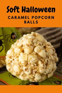 a close up of a popcorn ball on top of a green napkin with the words soft halloween caramel popcorn balls