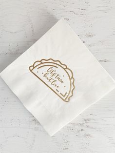 a white napkin with gold foil on it