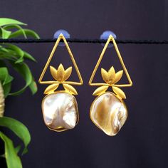 Fancy Party Wear Earrings. Made From Fine Quality Brass With Gold Platting. Perfect gift for any occasion for yourself and your dear ones. These Earrings can be worn with all kind of Outfits. It is advisable to store jewellery in a zip lock pouch (air tight pouch), keep away from water perfume and other chemicals and clean it with dry and soft cloth. Handmade Gold Pearl Earrings For Party, Handmade Pear-shaped Wedding Earrings, Handmade Pearl Drop Earrings For Party, Handmade Pear-shaped Pearl Earrings For Wedding, Water Perfume, Earrings Indian, Fancy Earrings, Bollywood Jewelry, Fancy Party