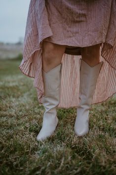 Western-inspired knee high boot with a sophisticated silhouette. Details: Leather upper. Manmade outsole. 15 in / 38.1 cm shaft height. 14 in / 35.56 cm boot opening. 2.5 in / 6.35 cm heel. Textile lining. Padded insole. Pull on style. Ivory color. Fits true to size. Western Knee-high Boots For Spring, White Wide Calf Western Knee-high Boots, White Wide Calf Knee-high Heeled Boots, Chic Beige Wide Calf Knee-high Boots, White Western Knee-high Boots With Wide Calf, Chic Cream Knee-high Boots With Pointed Toe, Chic Knee-high Boots For Spring, Chic Cream Pointed Toe Knee-high Boots, Spring Leather Knee-length Boots