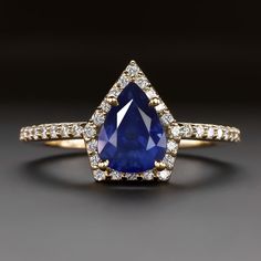 a pear shaped blue sapphire and diamond ring