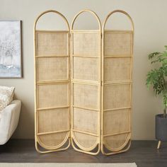 the room divider is made out of bamboo and has three sections for each side