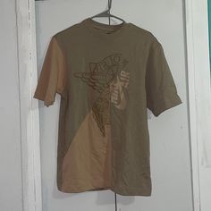 Size Mens Xs Brand New Never Worn Casual Brown Shirt With Graphic Print, Graphic Tee For Streetwear In Khaki, Khaki Graphic Tee For Streetwear, Olive Cotton Short Sleeve Shirt, Summer Khaki T-shirt For Streetwear, Khaki Crew Neck Top For Streetwear, Khaki Short Sleeve Shirt For Streetwear, Urban Khaki Cotton Tops, Urban Cotton Khaki Tops