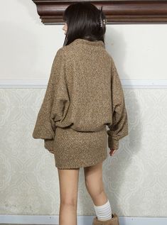 Cozy oversized sweater in a heathered brown wool blend. Features a distinctive dark brown X-pattern on the chest. High cowl neck for warmth. Long, loose sleeves for comfort. Lower portion has decorative side buttons for added style. Perfect for casual autumn/winter wear or rustic-inspired looks. Pair with leggings or skinny jeans for a comfy-chic ensemble. Model info Height: 160cm Weight: 42kg Wearing size: M Casual Brown Sweater Dress, Brown Relaxed Fit Sweater For Loungewear, Oversized Sweater Dress For Fall, Cozy Brown Sweater Dress For Winter, Chunky Knit Sweater Dress For Fall, Cozy Brown Winter Sweater Dress, Oversized Brown Long Sleeve Cardigan, Beige Sweater Dress For Fall Loungewear, Oversized Long Sleeve Sweater Dress For Winter