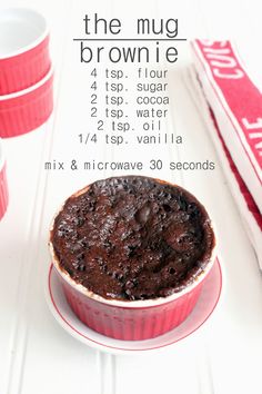 a brownie in a red dish on a white table