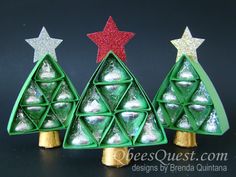 three small christmas trees made out of green plastic