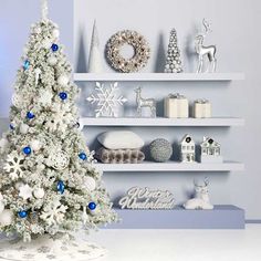 a white christmas tree sitting on top of a table next to shelves filled with ornaments