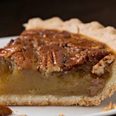 a slice of pecan pie on a white plate