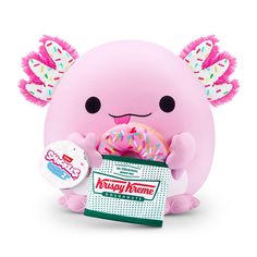 a pink stuffed animal holding a donut with sprinkles