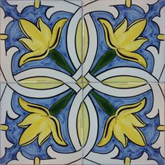 an artistic tile design with yellow flowers on blue and white tiles in the shape of a flower