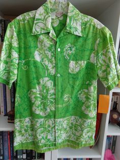 Unisex 1970's Hawaiian Floral Print Shirt An Original Hawaiian Togs Lime Green and White 100% Cotton Fabric 5 Front White Buttons SIZE: Men's Medium MEASUREMENTS (in inches): Shoulder to Shoulder (back): 18 Chest: 42 Waist: 40 Side Length (armpit to hem): 17 Arm Length (armpit to cuff): 4 1/2 Neck Opening: 16 Neck to Hem (back): 29 INTERNATIONAL CUSTOMER?? Please email for Shipping Info Green Casual Shirt With Vintage Print, Casual Green Shirt With Vintage Print, Fitted Green Hawaiian Shirt With Short Sleeves, Fitted Green Hawaiian Short Sleeve Shirt, Green Cotton Hawaiian Shirt For Spring, Spring Green Cotton Hawaiian Shirt, Vintage Cotton Hawaiian Shirt For Summer, Vintage Beach Shirt For Spring, Green Retro Print Shirt For Spring