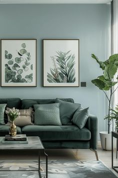 a living room with two paintings on the wall and a coffee table in front of it