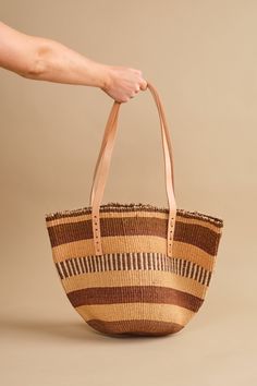 DIMENSION Each bag is unique, size varies COLOR Multi color MATERIAL Natural sisal fiber, leather strap Brown Straw Bag With Leather Trim And Double Handle, Brown Straw Shoulder Bag With Leather Trim, Natural Straw Tote Bag With Leather Trim, Natural Straw Shoulder Bag With Leather Trim, Brown Straw Tote Bag With Leather Trim, Natural Straw Bag With Leather Trim And Double Handle, Brown Straw Bag With Leather Trim For Everyday, Everyday Brown Straw Bag With Leather Trim, Everyday Straw Bag With Leather Trim And Double Handle