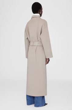 Designed by Anine Bing. Inspired by the best-selling Dylan Coat from the Classics Collection, the Dylan Maxi Coat is made from a soft double-faced wool-cashmere fabrication in a neutral taupe colorway. This practical-yet-luxurious layer is finished with traditional tailored details including a double-breasted closure and functional patch pockets. Fit: The Dylan Maxi Coat is cut for a relaxed and oversized fit with a full-length hem. It includes a removable self-tie belt that can be wrapped tight Full Length Coat, Long Sleeve Outerwear, Maxi Coat, Oversized Coat, Anine Bing, Everyday Wardrobe, Sport Wear, Black Coat, Snug Fit