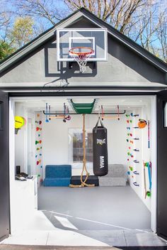 This chameleon of a detached space can be a home gym, a teen hangout hideaway, and—every once in a while—a parking spot. Garage Converted To Playroom, Play Area In Garage, Garage Play Area For Kids, Garage Play Area, Garage Multipurpose Room, Garage Into Playroom, Garage Playroom Conversion, Fitness Room Ideas Home, Home Gym Ideas Small Workout Rooms