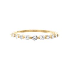 a yellow gold ring with five diamonds on the bottom, and one diamond in the middle