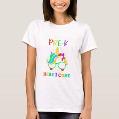 a woman wearing a white t - shirt with the words prek here i come