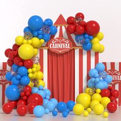 a carnival booth with balloons and confetti