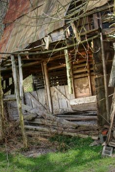 an old run down wooden house in the woods