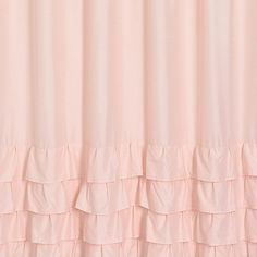 a pink shower curtain with ruffled edges