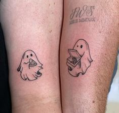 two people with matching tattoos on their legs, one has a box and the other has a ghost