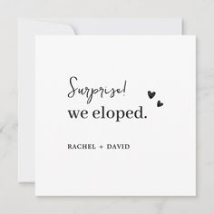 a card with the words surprise, we eloped and hearts in black ink