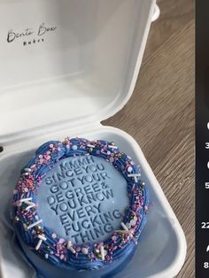 a birthday cake in a white box on a table