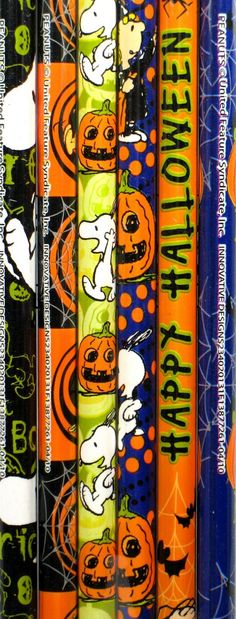 halloween themed pencils are lined up in a row