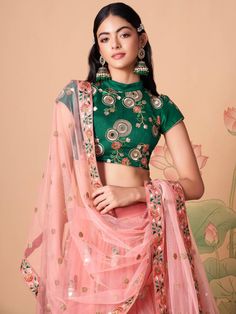 Become the subject of everyone’s conversation by outfitting in this delightful peach color lehenga made with net material designed with mirror work, thread embroidery, and sequin work. This peach lehenga comes with a green color art silk material choli made with embroidery and mirror work. It also comes with a peach color net material dupatta made with thread embroidery and sequin work. This peach lehenga is stitched and can be customized up to 42 inches. The choli will be fully stitched materia Semi-stitched Peach Lehenga With Traditional Drape, Peach Semi-stitched Lehenga With Traditional Drape, Peach Semi-stitched Traditional Lehenga, Peach Lehenga With Mirror Work And Traditional Drape, Peach Lehenga For Reception And Festivals, Peach Lehenga For Reception And Diwali, Semi-stitched Peach Lehenga With Dori Work, Peach Sharara With Pallu For Festivals, Peach Semi-stitched Lehenga With Dupatta