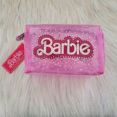 New With Tag. Barbie Logo Clear Pink Cosmetic Bag Stone/Glitter Accent. Barbie Zipper Pull. Zip Closure. Clear Pink. Approximately 7 Inch X 4.25 Inch X 4.5 Inch Trendy Pink Glitter Bags, Tag Barbie, Bling Makeup, Pink Makeup Bag, Rhinestone Makeup, Movie Makeup, Barbie Logo, Barbie Makeup, Pink Cosmetics