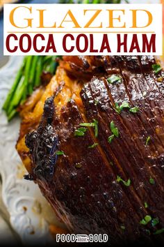 glazed coca cola ham on a plate with asparagus